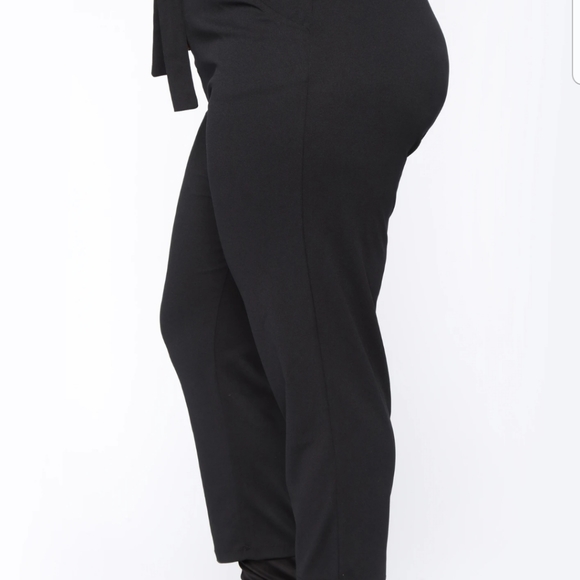 Black stretch belted pants. - Picture 2 of 5